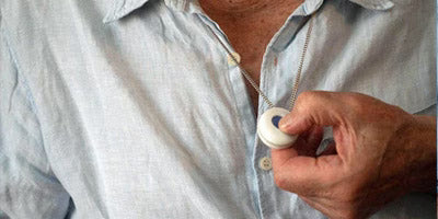 Close up of personal holding personal alarm 