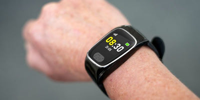 Personal Alarm Watch on a wrist with a blurred background